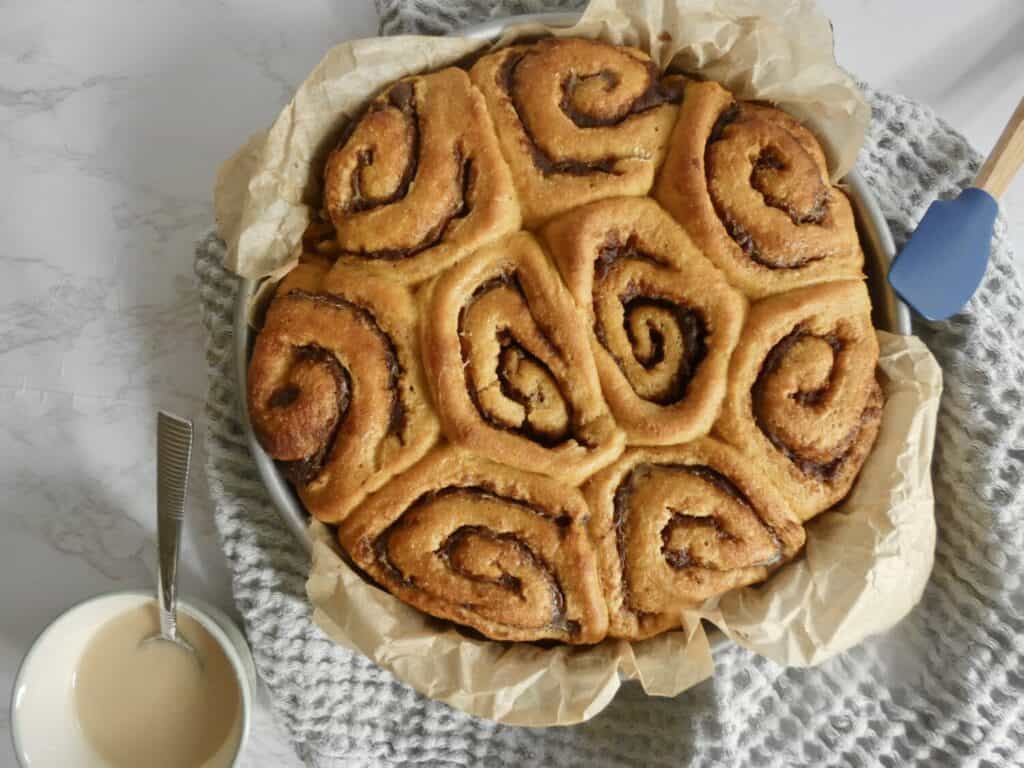 Top down view of pan of pumpkin pie cinnamon rolls