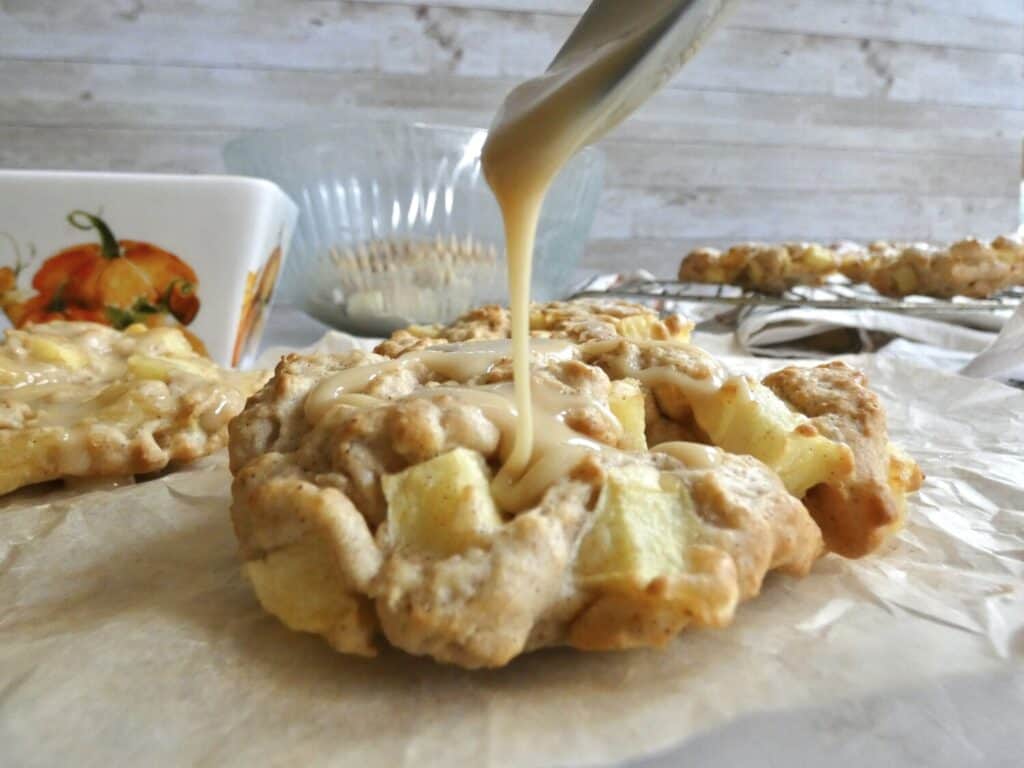 air fryer apple fritter being glazed