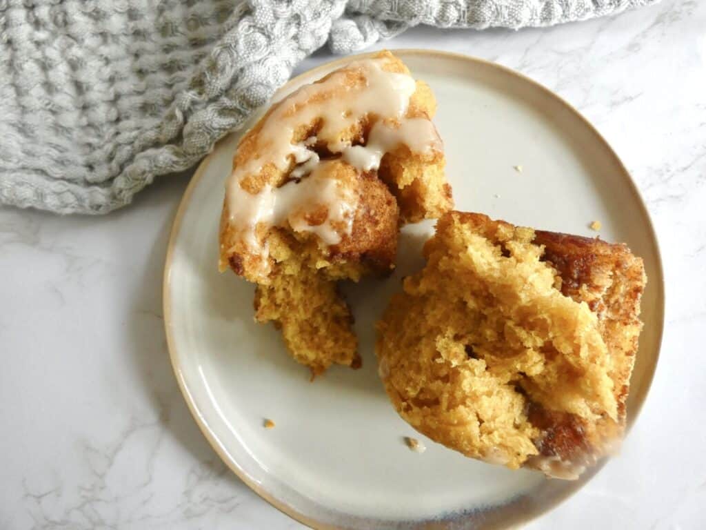 pulled apart pumpkin pie cinnamon rolls on a plate