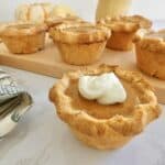 mini pumpkin pie with swirl of cream