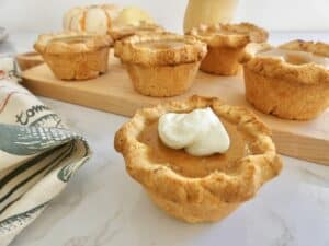 mini pumpkin pie with swirl of cream