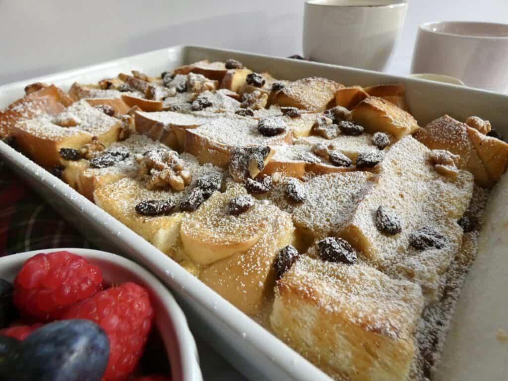 full pan of easy bread pudding with powdered sugar