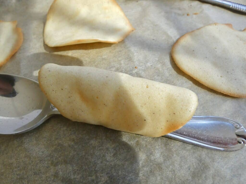 simple french tuile wrapped around a spoon