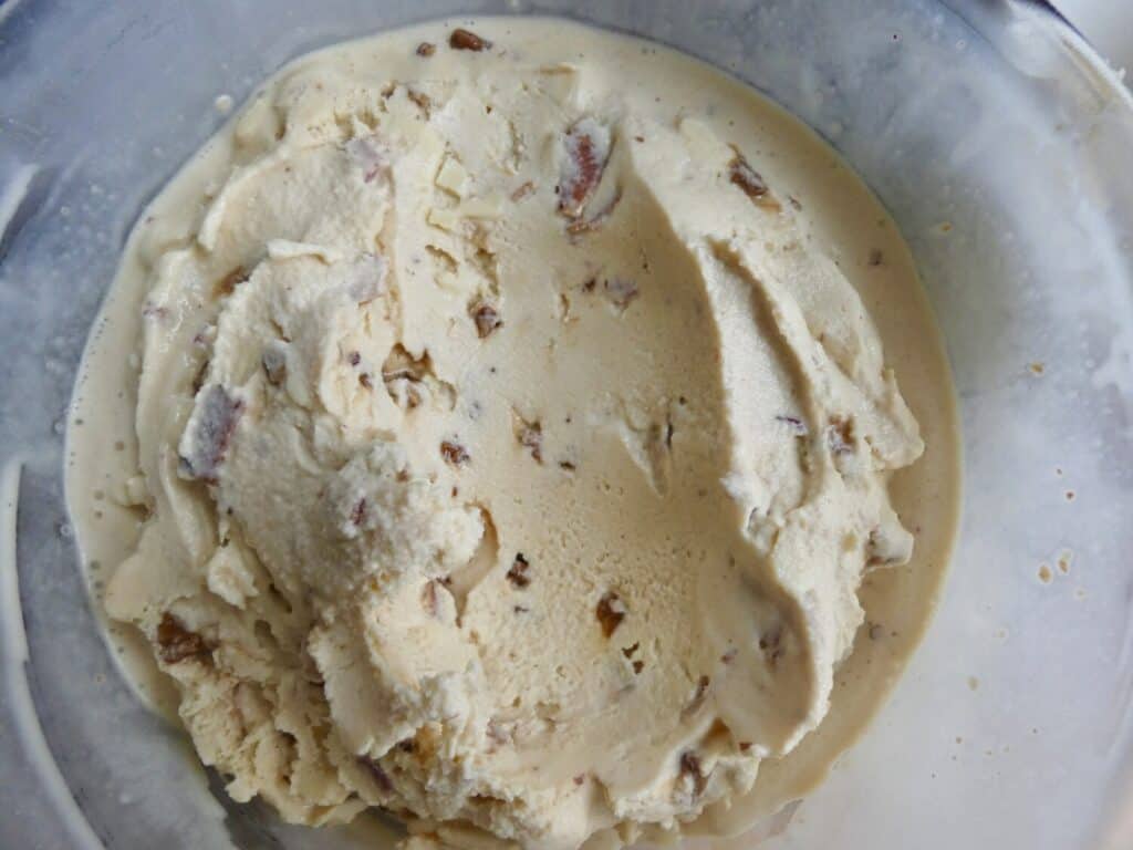 bowl of Maple Bacon Pecan Crunch Ice Cream with scoop taken out