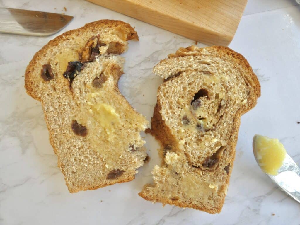 slice of Whole wheat cinnamon raisin swirl bread split in half