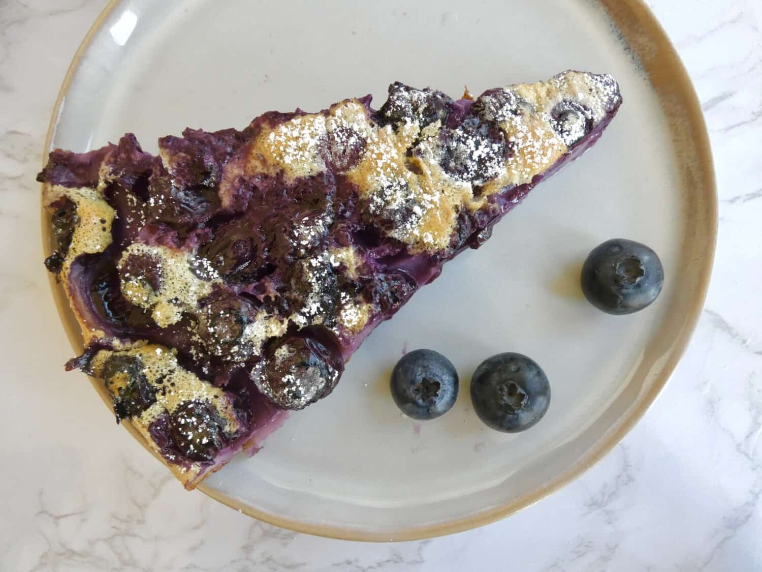 slice of Julia Child inspired Berry Clafoutis