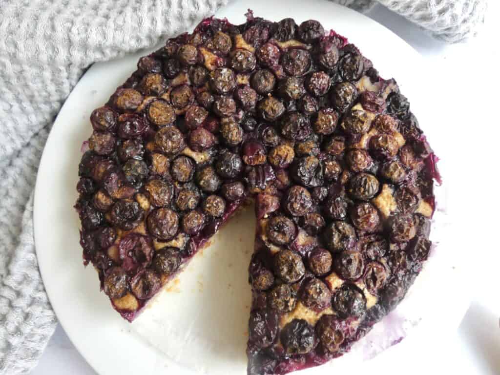 Healthy One-Bowl Berry Cake with missing slice