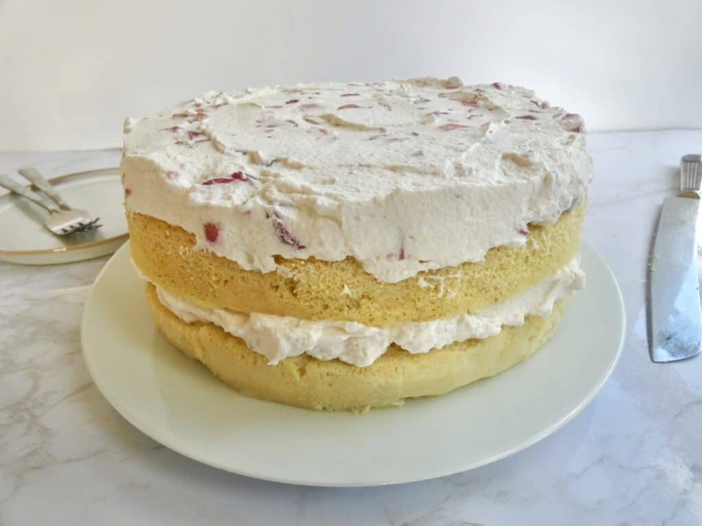 front view of strawberries and cream castella cake