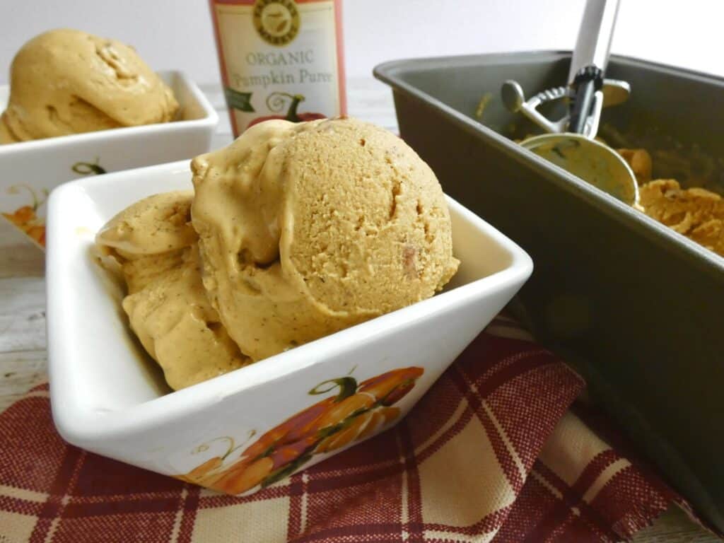 scoops of maple pumpkin pecan ice cream in a bowl