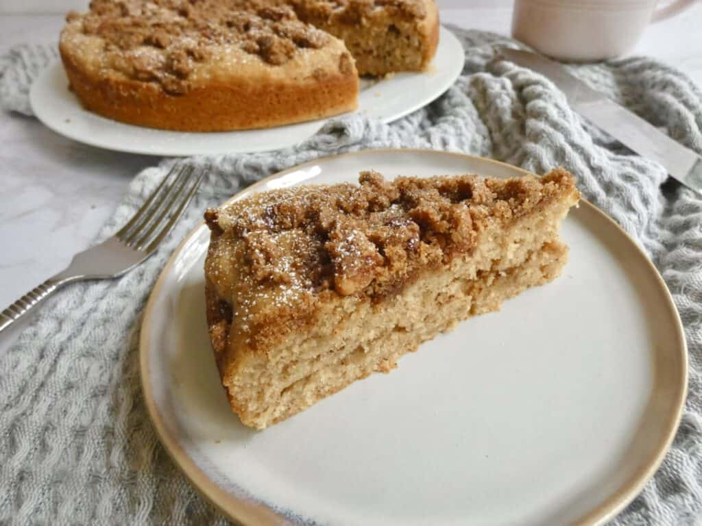 apple cider coffee cake with pecan streusel with fork