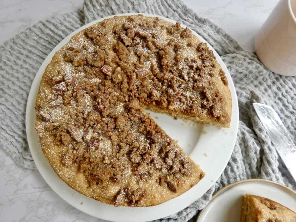 apple cider coffee cake with pecan streusel with missing slice