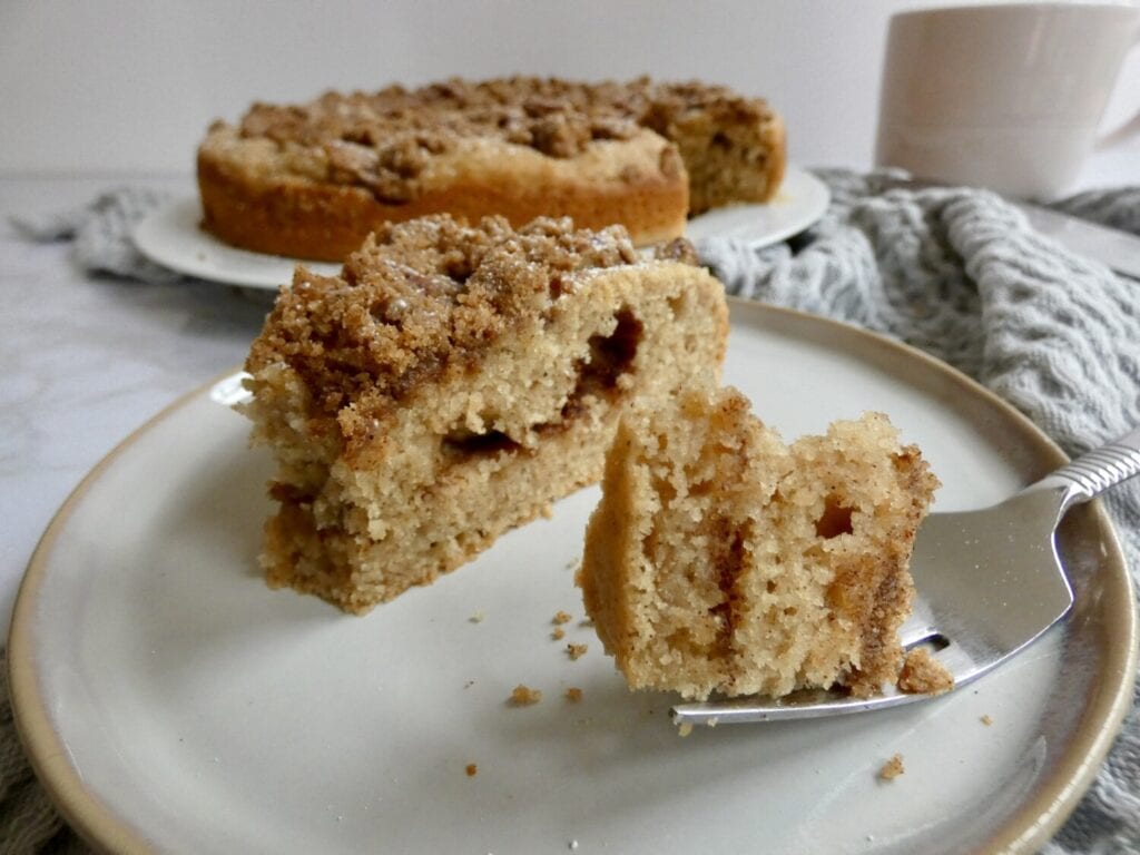 close up of apple cider coffee cake with pecan streusel