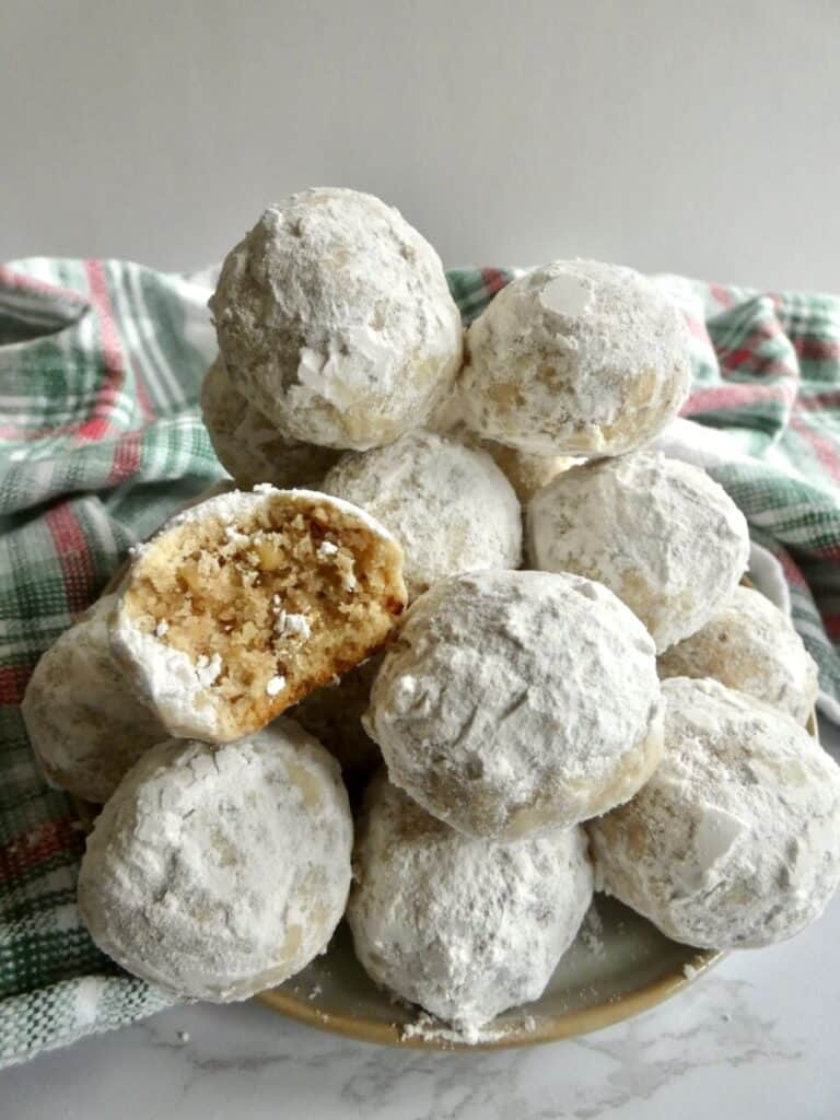 plate of healthier Russian tea cakes with one missing a bite