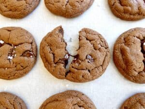 soft and chewy double chocolate cookies on parchment paper