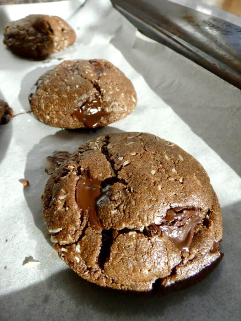 secret ingredient fudgy double chocolate cookies on parchment paper