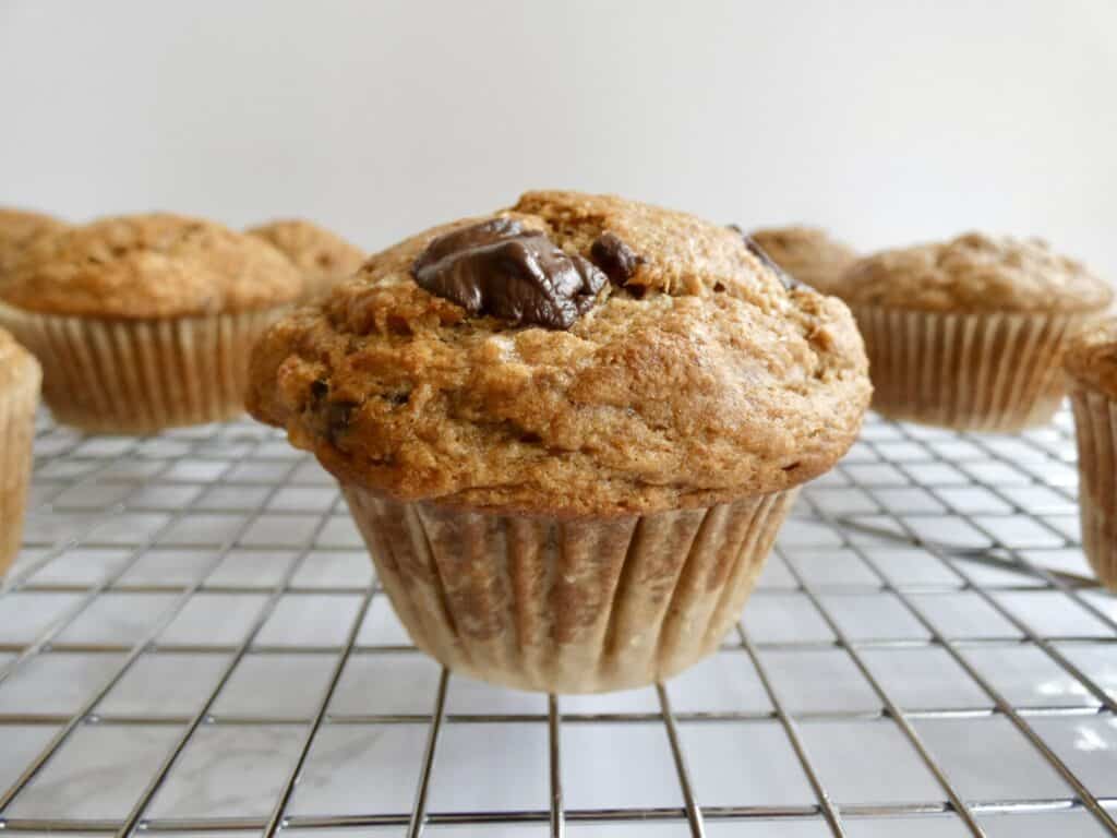 healthier chocolate chip banana muffin on wire rack