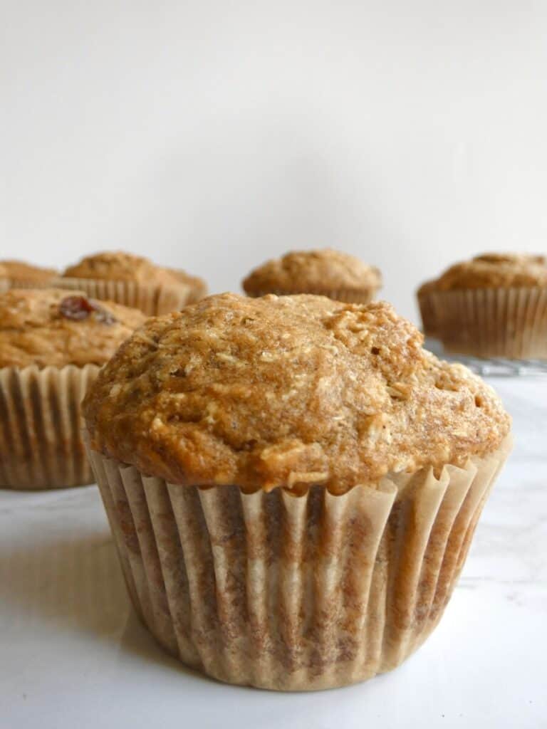 close up of healthy whole wheat banana muffin on wrapper