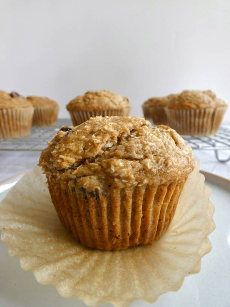 healthy whole wheat banana muffin on paper liner