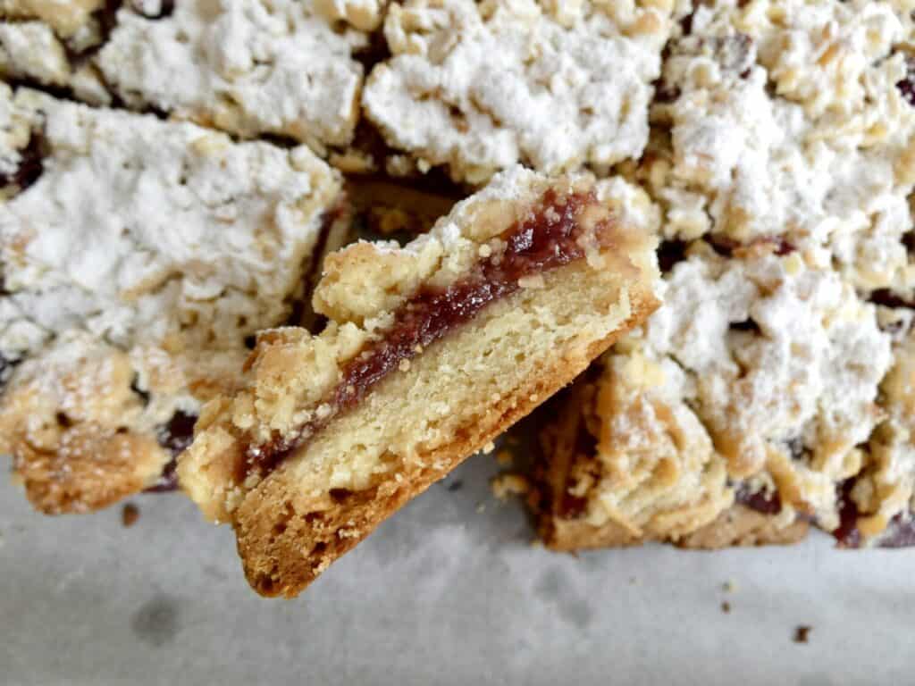 Close up of layers of raspberry crumb bars