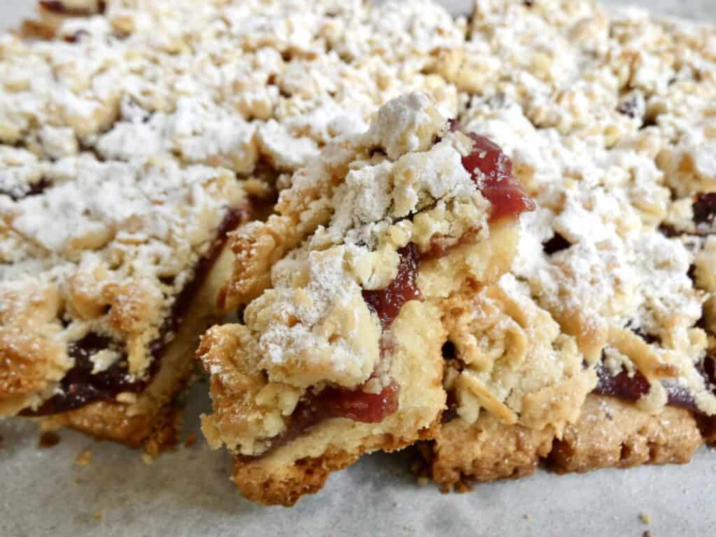 raspberry crumb bar with missing bite