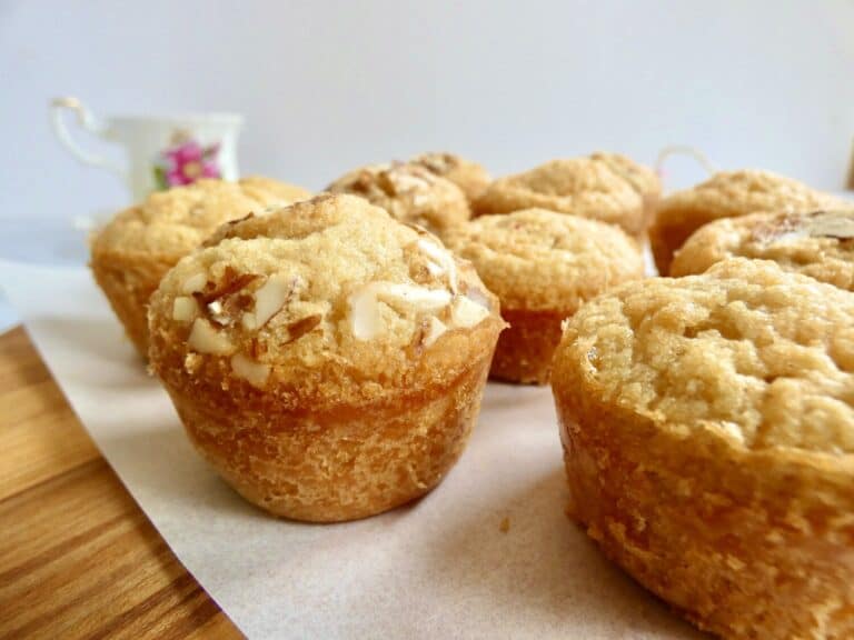 close up of french almond financiers on wood board