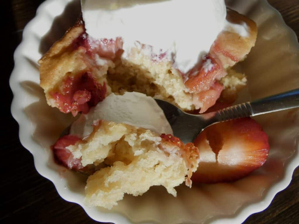 close up of a spoonful of Easy Jammy Strawberry Cake