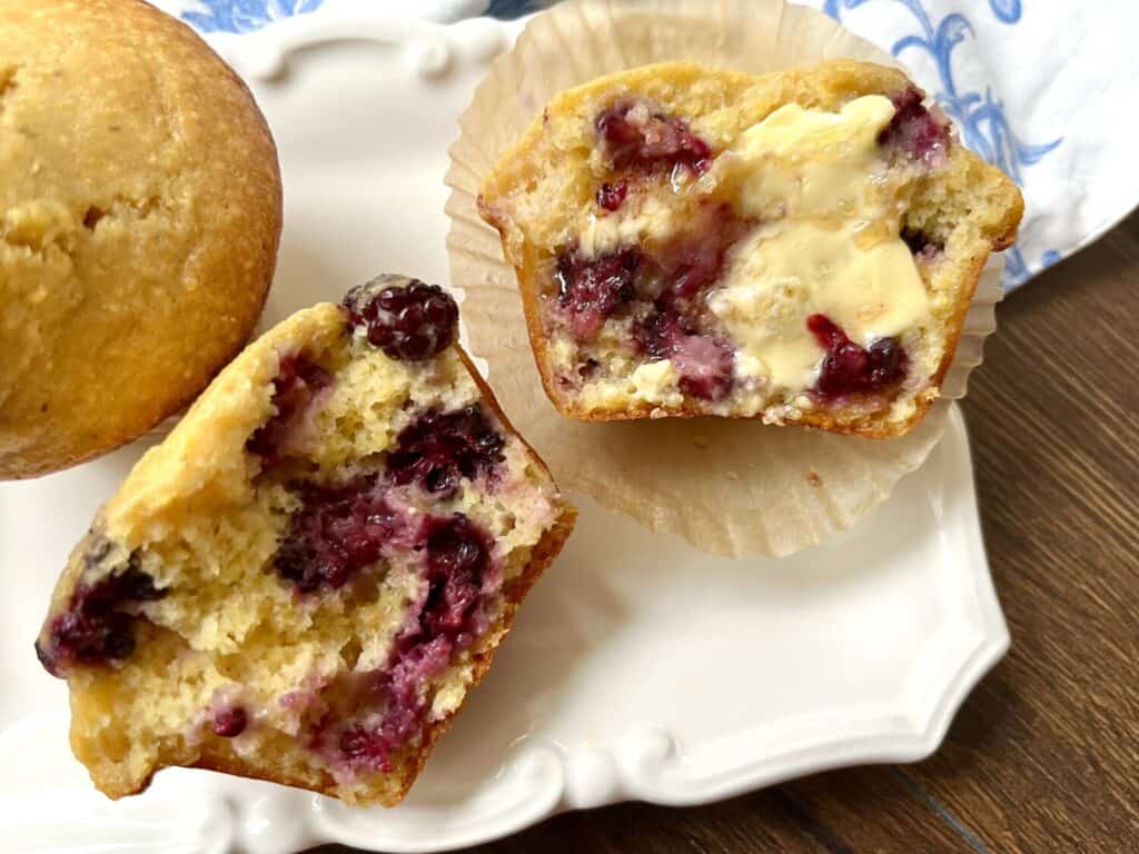 healthier blackberry cornbread muffin with smear of honey butter