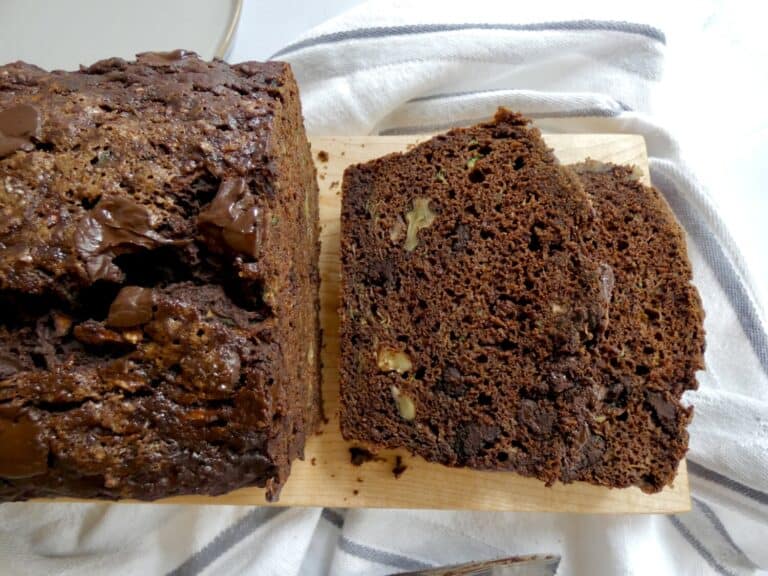 two slices of healthier double chocolate zucchini bread on a cutting board