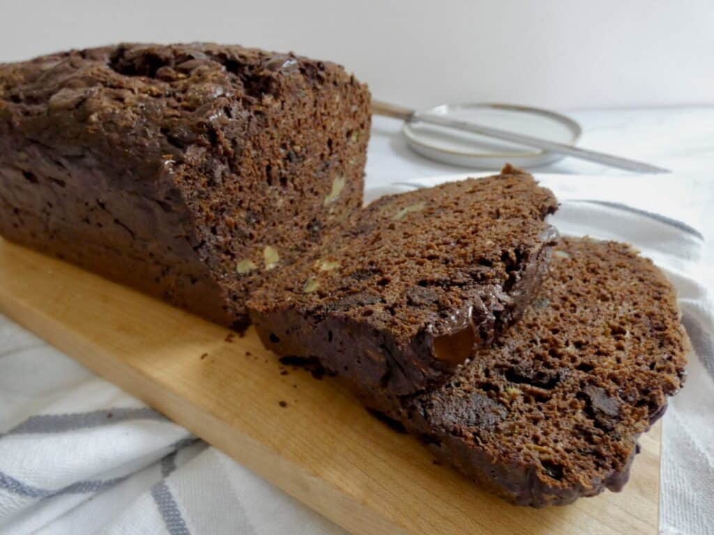 slices of healthier double chocolate zucchini bread on a cutting board