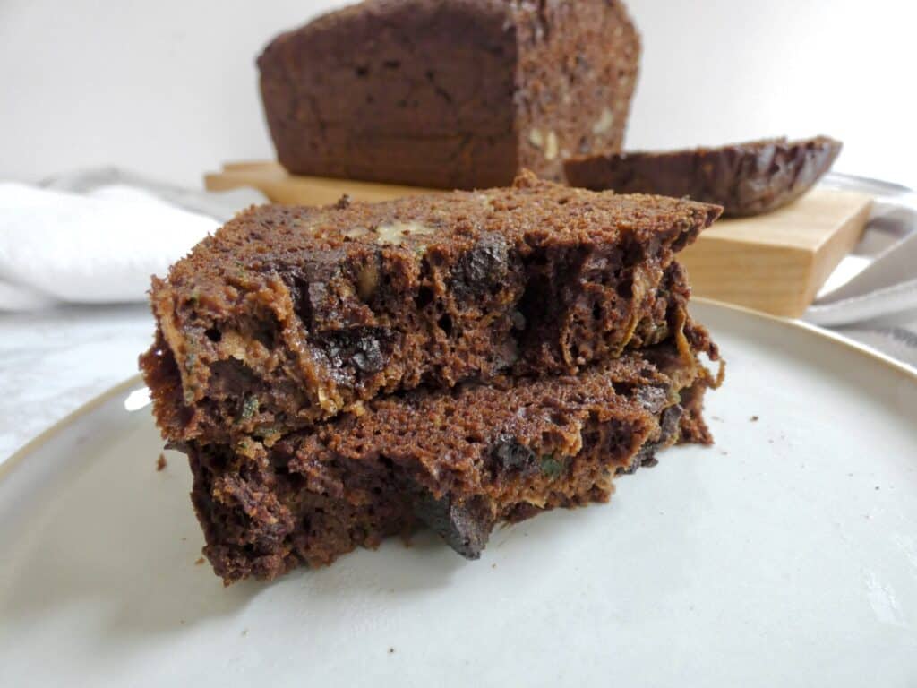 slices of healthier double chocolate zucchini bread stacked on top of each other