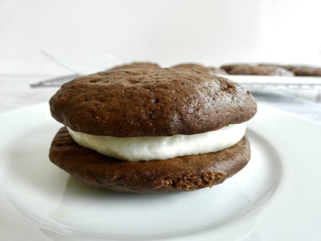 close up of a healthier chocolate whoopie pie on a plate