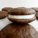 close up of a healthier chocolate whoopie pie on parchment paper