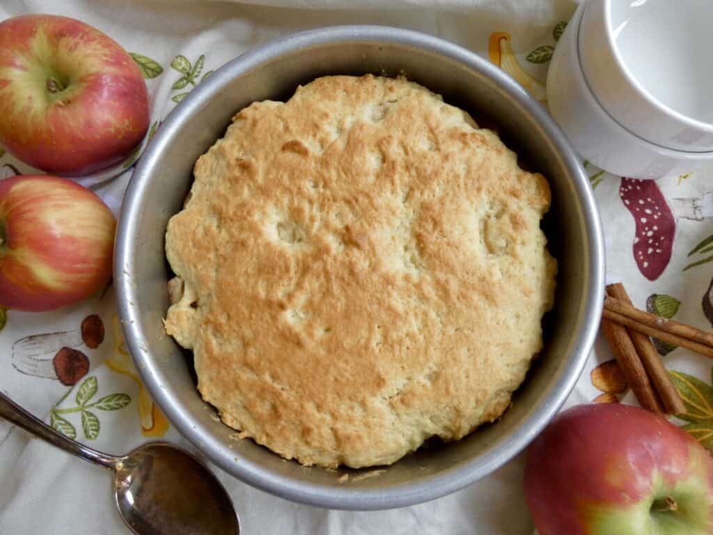 top down view of Eve's Pudding surrounded by apples