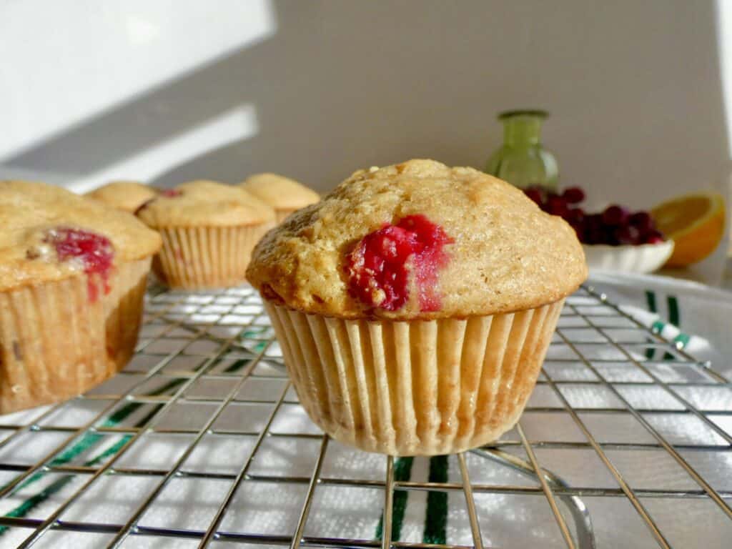 close up of Cranberry Orange Muffin on wire rack